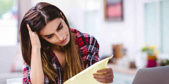 Why-is-it-a-Bad-Idea-to-Write-Your-Own-Will Woman holding head in hands
